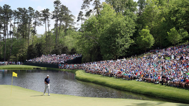 AUGUSTA, GEORGIA - APRIL 11: A gallery of patrons look on while Tiger Woods of the United States walks across the 16th green during the first round of the Masters at Augusta National Golf Club on April 11, 2019 in Augusta, Georgia.
