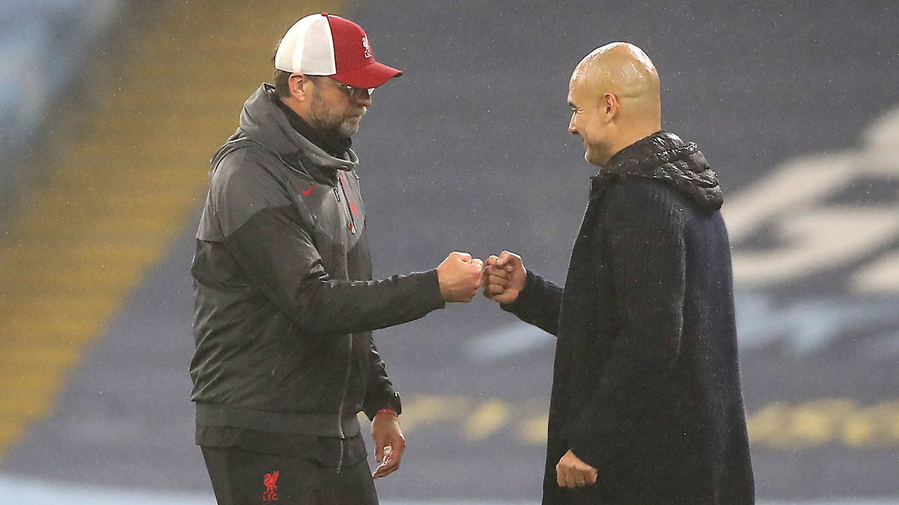 Liverpool manager Jurgen Klopp (left) and Manchester City manager Pep Guardiola after the final whistle during the Premier League match at the Etihad Stadium, Manchester.