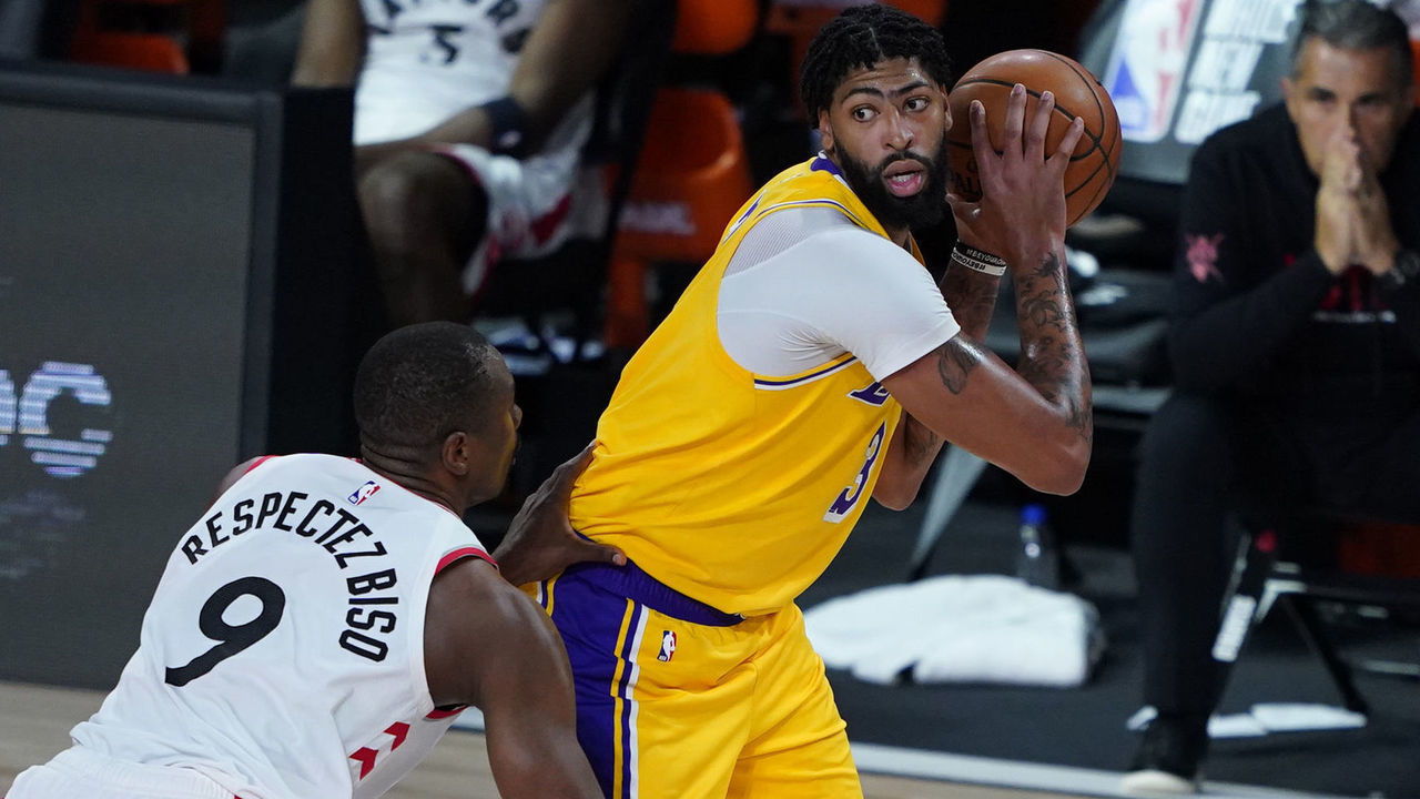 LAKE BUENA VISTA, FLORIDA - AUGUST 01: Anthony Davis #3 of the Los Angeles posts up against Serge Ibaka #9 of the Toronto Raptors during the second half of an NBA basketball game at The Arena in the ESPN Wide World Of Sports Complex on August 1, 2020 in Lake Buena Vista, Florida.