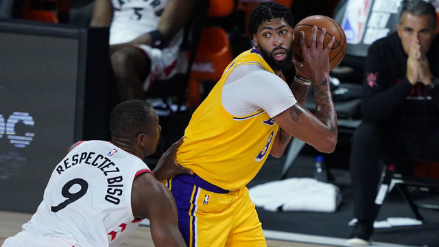 LAKE BUENA VISTA, FLORIDA - AUGUST 01: Anthony Davis #3 of the Los Angeles posts up against Serge Ibaka #9 of the Toronto Raptors during the second half of an NBA basketball game at The Arena in the ESPN Wide World Of Sports Complex on August 1, 2020 in Lake Buena Vista, Florida.