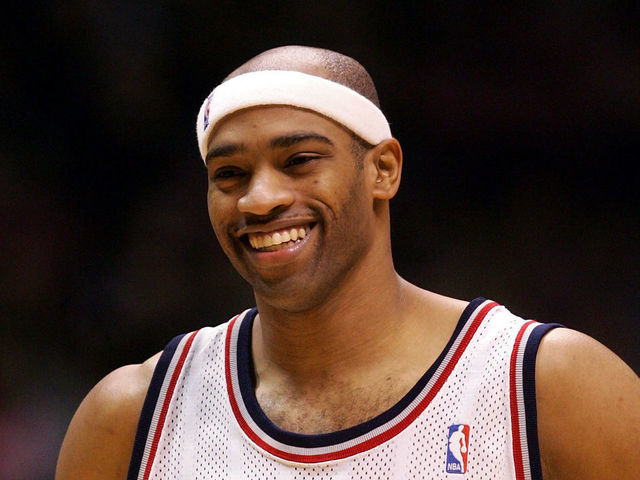 EAST RUTHERFORD, NJ - DECEMBER 30: Vince Carter #15 of the New Jersey Nets smiles during a time out against the Indiana Pacers on December 30, 2004 at Continental Airlines Arena in East Rutherford, New Jersey. NOTE TO USER: User expressly acknowledges and agrees that, by downloading and/or using this Photograph, user is consenting to the terms and conditions of the Getty Images License Agreement.