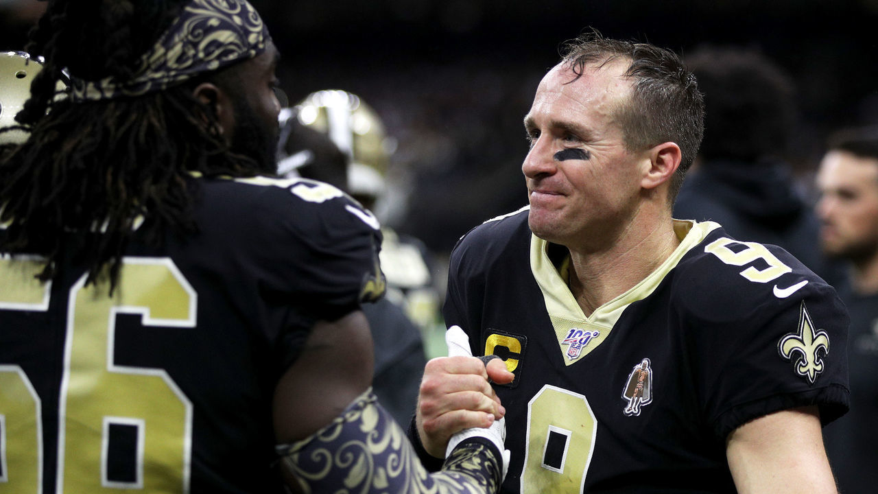 NEW ORLEANS, LOUISIANA - DECEMBER 16: Quarterback Drew Brees #9 of the New Orleans Saints outside linebacker Demario Davis #56 celebrate his 540th career touchdown pass, for the most in league history, in the third quarter of the game against the Indianapolis Colts at Mercedes Benz Superdome on December 16, 2019 in New Orleans, Louisiana.