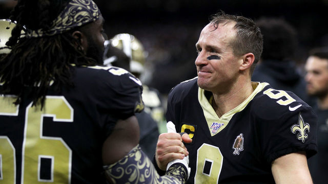 NEW ORLEANS, LOUISIANA - DECEMBER 16: Quarterback Drew Brees #9 of the New Orleans Saints outside linebacker Demario Davis #56 celebrate his 540th career touchdown pass, for the most in league history, in the third quarter of the game against the Indianapolis Colts at Mercedes Benz Superdome on December 16, 2019 in New Orleans, Louisiana.