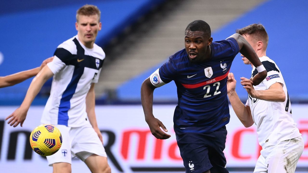 France's forward Marcus Thuram (R) eyes the ball during the friendly football match between France and Finland at the Stade de France in Saint-Denis, Paris outskirts, on November 11, 2020.