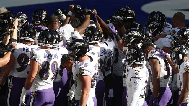 INDIANAPOLIS, INDIANA - NOVEMBER 08: Members of the Baltimore Ravens huddle during warm ups before a game against the Indianapolis Colts at Lucas Oil Stadium on November 08, 2020 in Indianapolis, Indiana.
