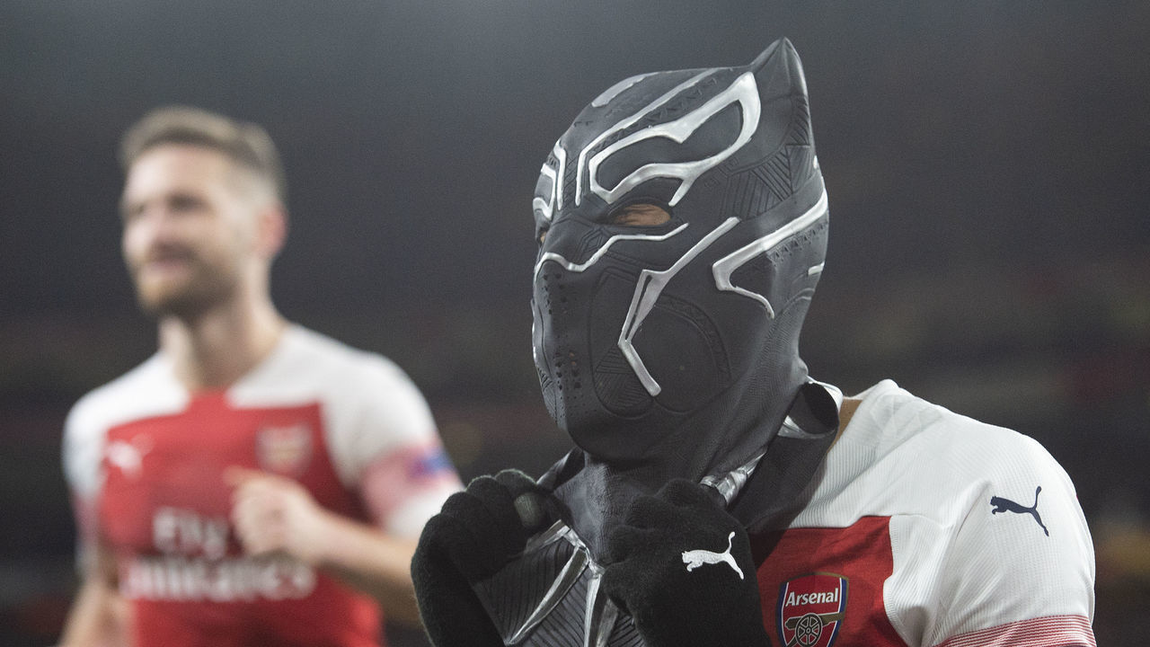 LONDON, ENGLAND - MARCH 14: Pierre-Emerick Aubameyang of Arsenal celebrates his second goal by wearing a mask of the Marvel Comics character the Black Panther during the UEFA Europa League Round of 16 Second Leg match between Arsenal and Stade Rennais at Emirates Stadium on March 14, 2019 in London, England.