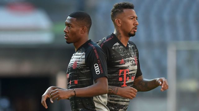 Bayern Munich's Austrian defender David Alaba (L) and Bayern Munich's defender Jerome Boateng (R) arrive for the German first division Bundesliga football match FC Bayern Munich v Borussia Moenchengladbach on June 13, 2020 in Munich, southern Germany.