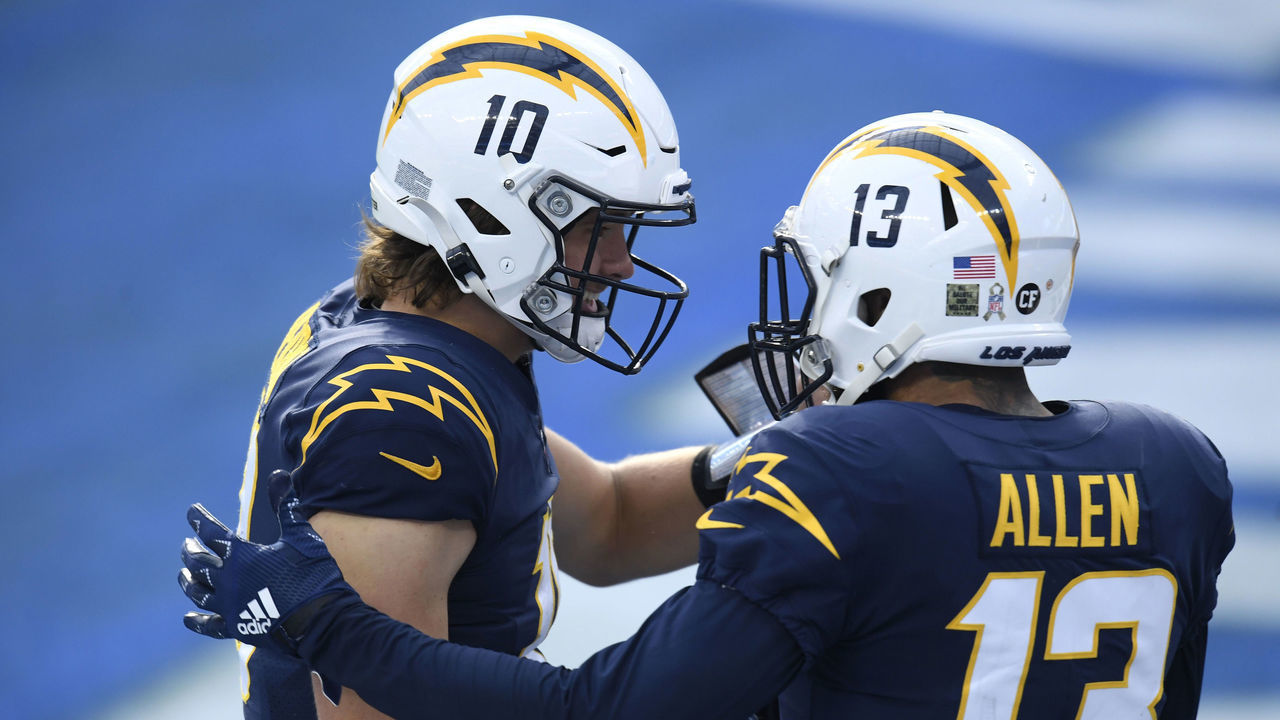 INGLEWOOD, CALIFORNIA - NOVEMBER 08: Keenan Allen #13 of the Los Angeles Chargers celebrates his second quarter touchdown with Justin Herbert #10 while playing the Las Vegas Raiders at SoFi Stadium on November 08, 2020 in Inglewood, California.