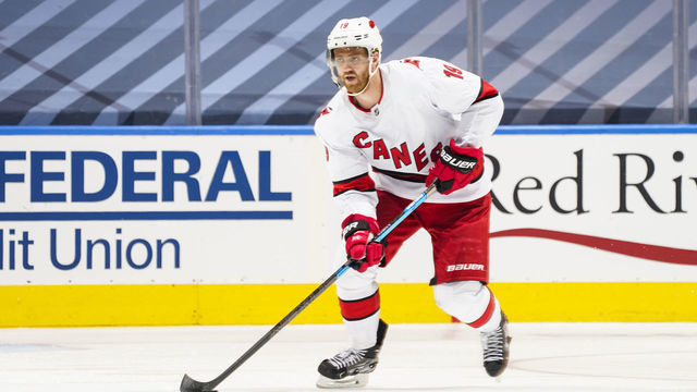TORONTO, ONTARIO - AUGUST 12: Dougie Hamilton #19 of the Carolina Hurricanes plays the puck against the Boston Bruins during the second period in Game One of the Eastern Conference First Round of the 2020 NHL Stanley Cup Playoff at Scotiabank Arena on August 12, 2020 in Toronto, Ontario.