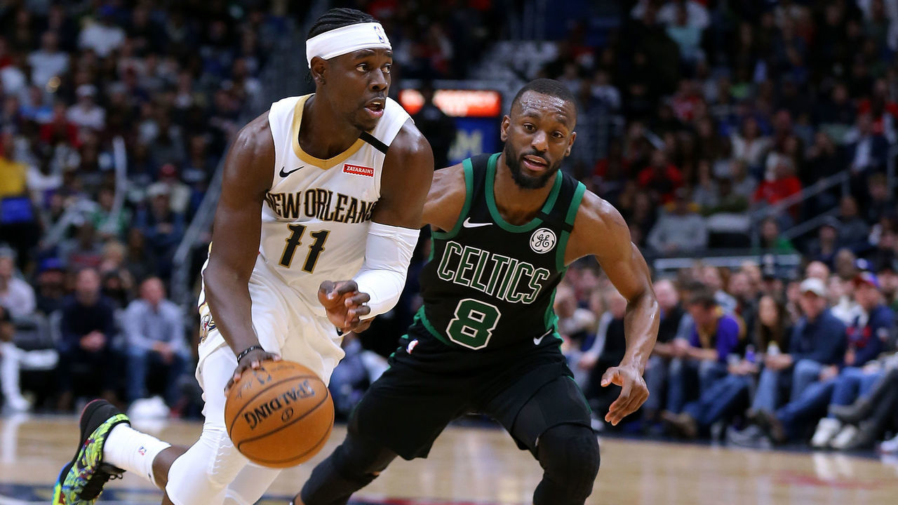 NEW ORLEANS, LOUISIANA - JANUARY 26: Jrue Holiday #11 of the New Orleans Pelicans drives against Kemba Walker #8 of the Boston Celtics during a game at the Smoothie King Center on January 26, 2020 in New Orleans, Louisiana.