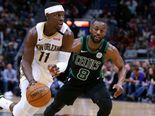 NEW ORLEANS, LOUISIANA - JANUARY 26: Jrue Holiday #11 of the New Orleans Pelicans drives against Kemba Walker #8 of the Boston Celtics during a game at the Smoothie King Center on January 26, 2020 in New Orleans, Louisiana.