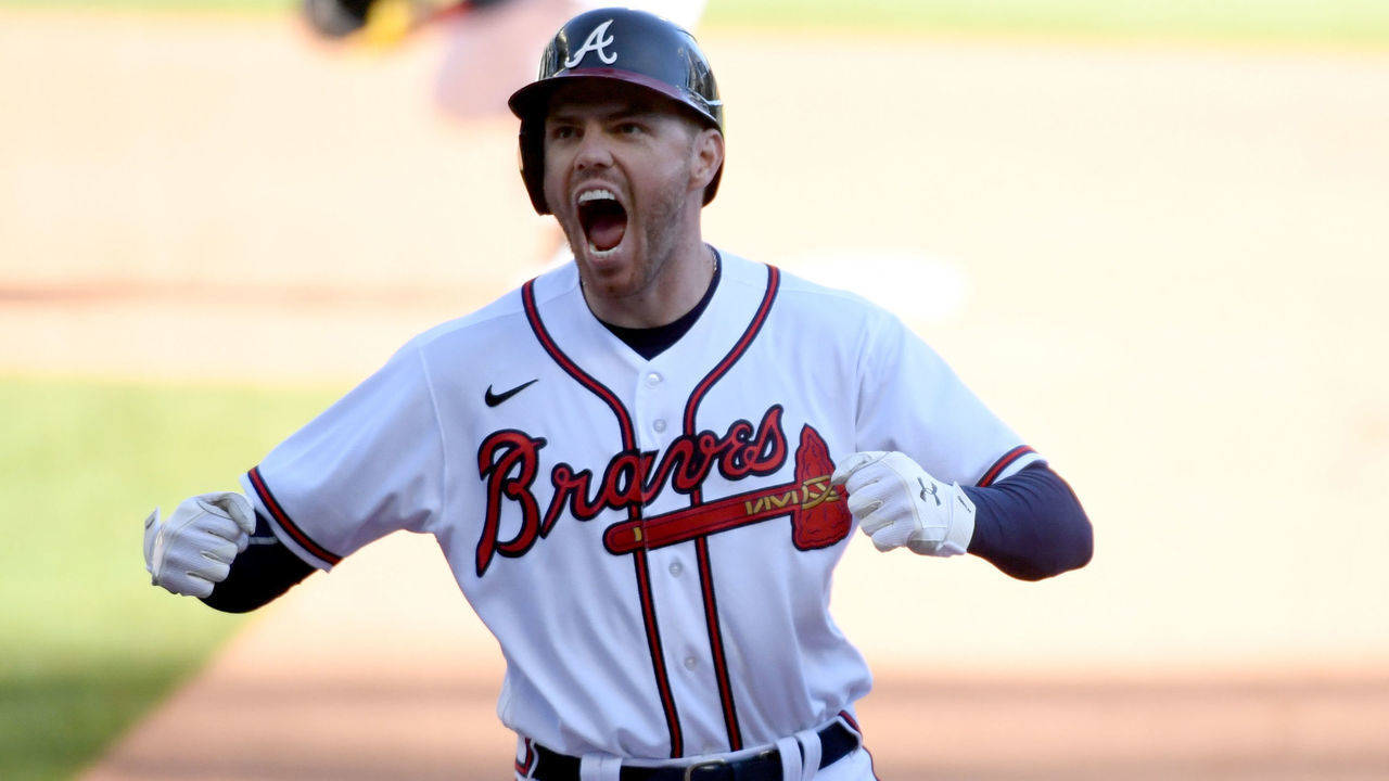 ATLANTA, GA - SEPTEMBER 30: Freddie Freeman #5 of the Atlanta Braves celebrates after hitting a walk-off single to win Game 1 of the Wild Card Series between the Cincinnati Reds and the Atlanta Braves at Truist Park on Wednesday, September 30, 2020 in Atlanta, Georgia. The Braves defeated the Reds 1-0 in 13 innings.