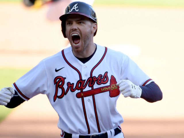 ATLANTA, GA - SEPTEMBER 30: Freddie Freeman #5 of the Atlanta Braves celebrates after hitting a walk-off single to win Game 1 of the Wild Card Series between the Cincinnati Reds and the Atlanta Braves at Truist Park on Wednesday, September 30, 2020 in Atlanta, Georgia. The Braves defeated the Reds 1-0 in 13 innings.