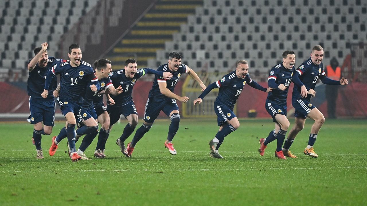 Scotland's players celebrate after winning the Euro 2020 play-off qualification football match between Serbia and Scotland at the Red Star Stadium in Belgrade on November 12, 2020.
