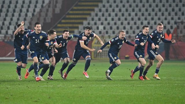 Scotland's players celebrate after winning the Euro 2020 play-off qualification football match between Serbia and Scotland at the Red Star Stadium in Belgrade on November 12, 2020.