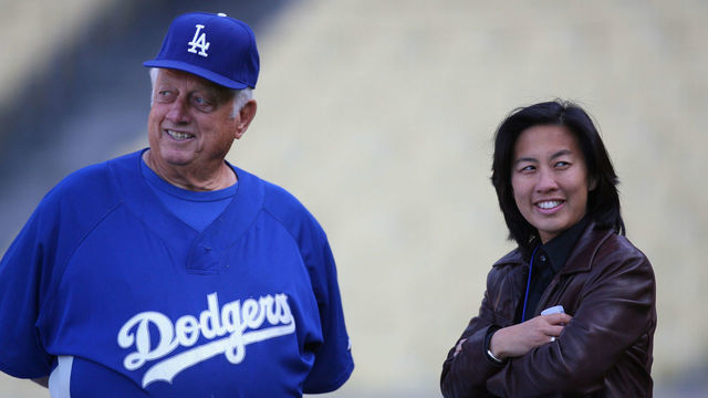 Former Dodgers Manager Tommy Lasorda talks with Assistant General Manager Kim Ng of the Los Angeles Dodgers, before game against the Boston Red Sox at Dodger Stadium in Los Angeles, CA.