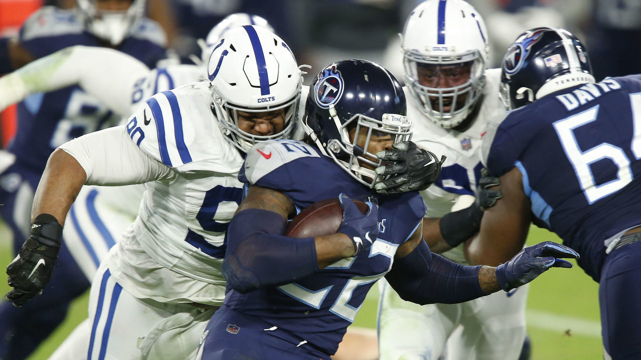 NASHVILLE, TN - NOVEMBER 12: Tennessee Titans Running Back Derrick Henry (22) take a hand to the face from Indianapolis Colts Nose Tackle Grover Stewart (90) in game action during a NFL game between the Indianapolis Colts and the Tennessee Titans on November 12, 2020 at LP Field in Nashville TN.