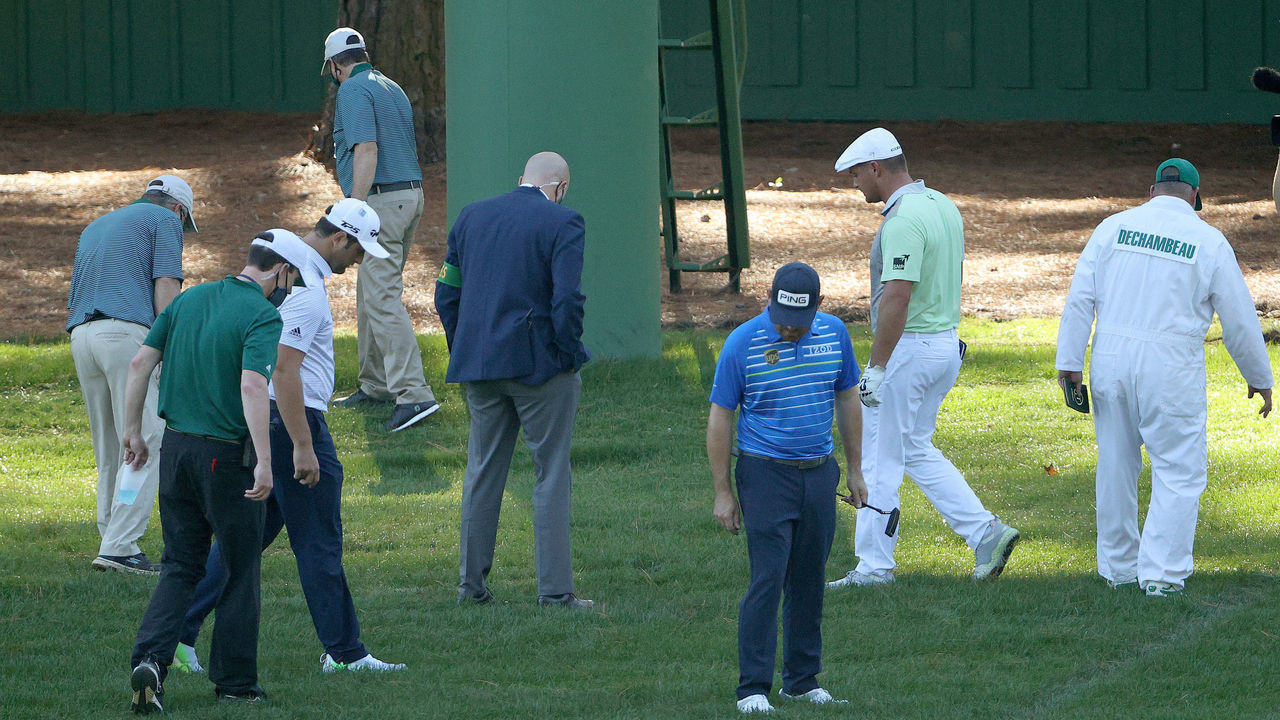 AUGUSTA, GEORGIA - NOVEMBER 13: Bryson DeChambeau of the United States looks for his ball with Jon Rahm of Spain and Louis Oosthuizen of South Africa on the third hole during the second round of the Masters at Augusta National Golf Club on November 13, 2020 in Augusta, Georgia.