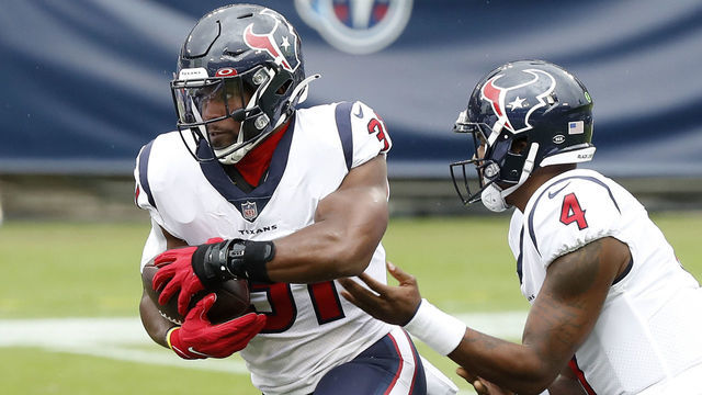 NASHVILLE, TENNESSEE - OCTOBER 18: Running back David Johnson #31 of the Houston Texans takes the hand off from quarterback Deshaun Watson #4 in the first quarter against the Tennessee Titans at Nissan Stadium on October 18, 2020 in Nashville, Tennessee.