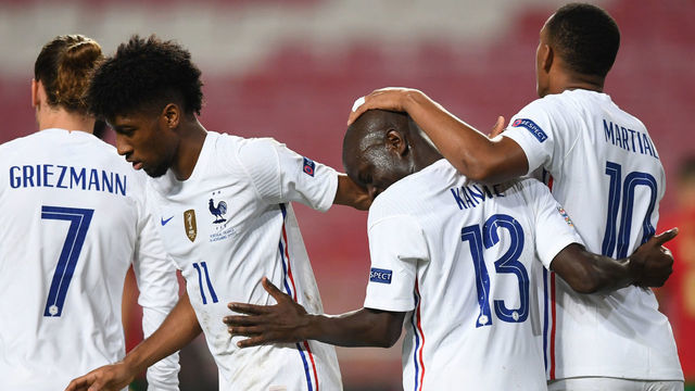 France's midfielder N'Golo Kante (2R) celebrates his goal with teammates during the UEFA Nations League A group 3 football match between Portugal and France at the Luz stadium in Lisbon on November 14, 2020.