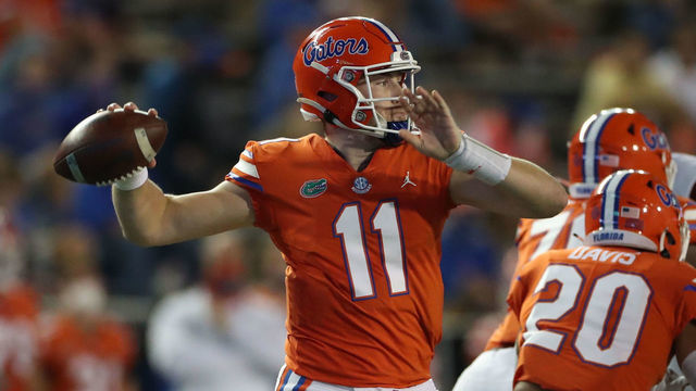 GAINESVILLE, FL - NOVEMBER 14: Kyle Trask #11 of the Florida Gators throws a pass against the Arkansas Razorbacks at Ben Hill Griffin Stadium on November 14, 2020 in Gainesville, Florida.