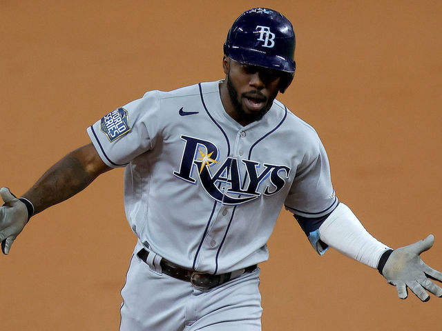 ARLINGTON, TEXAS - OCTOBER 27: Randy Arozarena #56 of the Tampa Bay Rays celebrates as he rounds the bases after hitting a solo home run against the Los Angeles Dodgers during the first inning in Game Six of the 2020 MLB World Series at Globe Life Field on October 27, 2020 in Arlington, Texas.