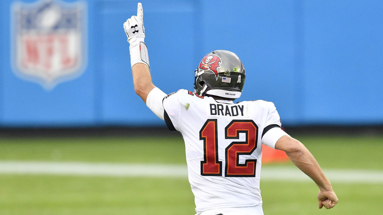 CHARLOTTE, NORTH CAROLINA - NOVEMBER 15: Tom Brady #12 of the Tampa Bay Buccaneers celebrates after a 98-yard touchdown run by Ronald Jones II #27 during their NFL game against the Carolina Panthers at Bank of America Stadium on November 15, 2020 in Charlotte, North Carolina.