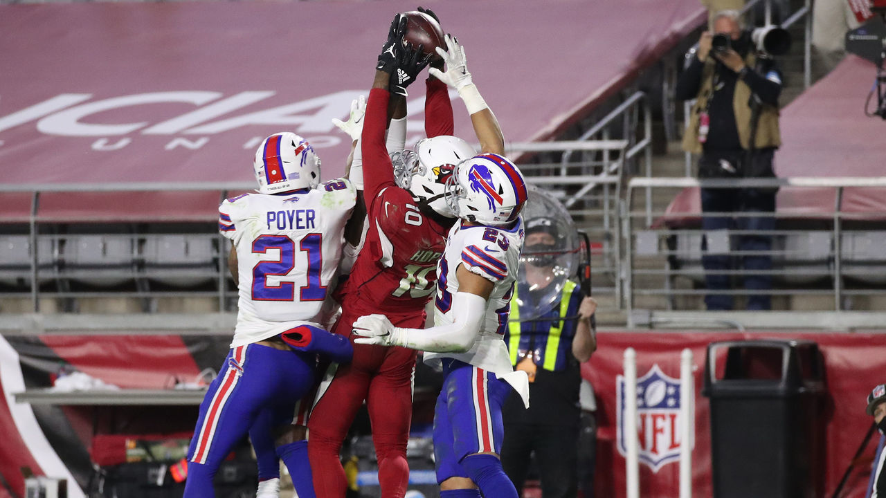 GLENDALE, ARIZONA - NOVEMBER 15: Wide receiver DeAndre Hopkins #10 of the Arizona Cardinals catches the game-winning touchdown pass as safety Jordan Poyer #21 and safety Micah Hyde #23 of the Buffalo Bills defend during the final seconds of the fourth quarter at State Farm Stadium on November 15, 2020 in Glendale, Arizona.