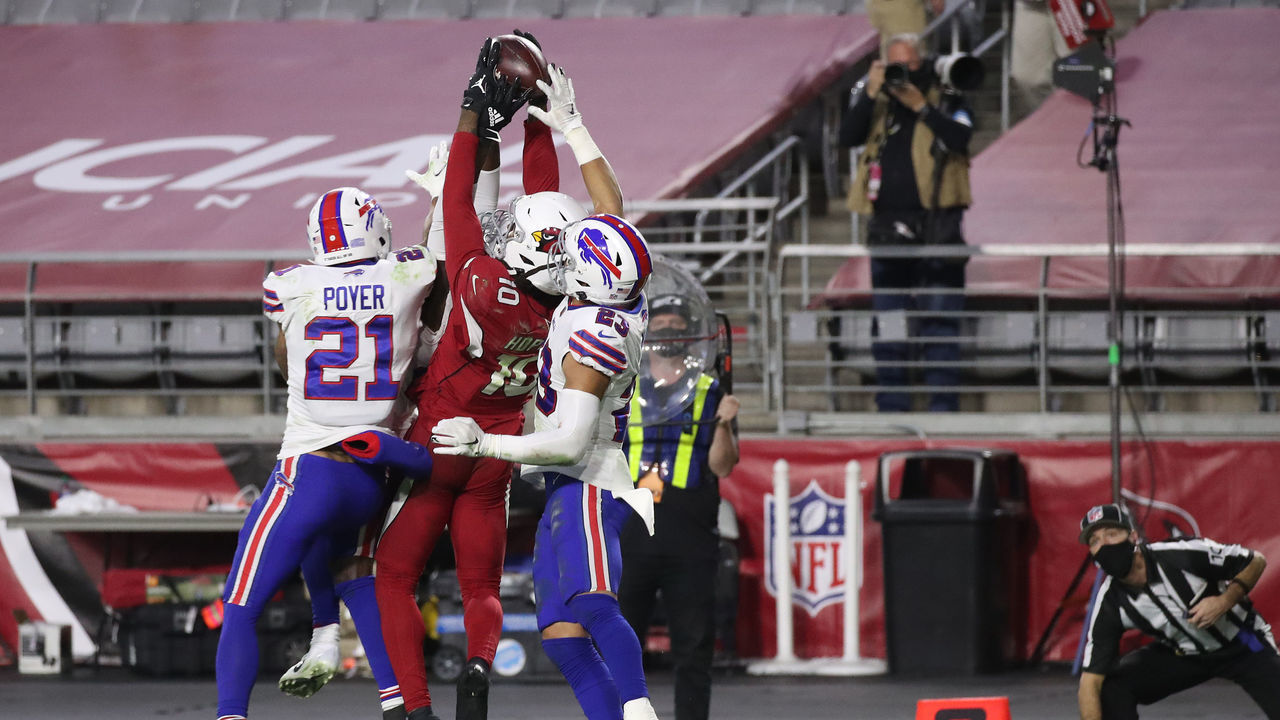 GLENDALE, ARIZONA - NOVEMBER 15: Wide receiver DeAndre Hopkins #10 of the Arizona Cardinals catches the game-winning touchdown pass as safety Jordan Poyer #21 and safety Micah Hyde #23 of the Buffalo Bills defend during the final seconds of the fourth quarter at State Farm Stadium on November 15, 2020 in Glendale, Arizona.