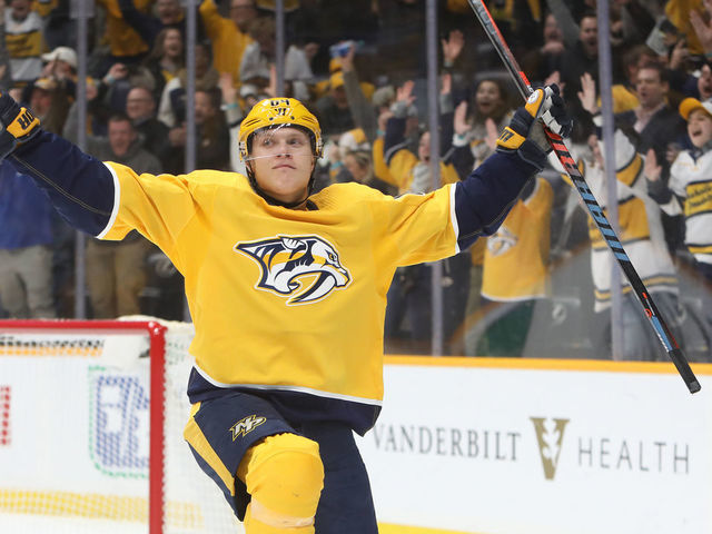 NASHVILLE, TN - FEBRUARY 27: Nashville Predators right wing Mikael Granlund (64) celebrates his overtime game-winning goal at the conclusion of the NHL game between the Nashville Predators and Calgary Flames, held on February 27, 2020, at Bridgestone Arena in Nashville, Tennessee.