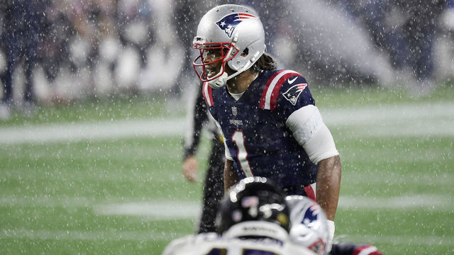 FOXBOROUGH, MASSACHUSETTS - NOVEMBER 15: Cam Newton #1 of the New England Patriots lines up in a down pour against the Baltimore Ravens during the second half at Gillette Stadium on November 15, 2020 in Foxborough, Massachusetts.