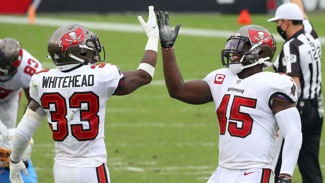 TAMPA, FL - OCTOBER 04: Jordan Whitehead (33) and Devin White (45) of the Buccaneers celebrates a defensive stop during the regular season game between the Los Angeles Chargers and the Tampa Bay Buccaneers on October 04, 2020 at Raymond James Stadium in Tampa, Florida.