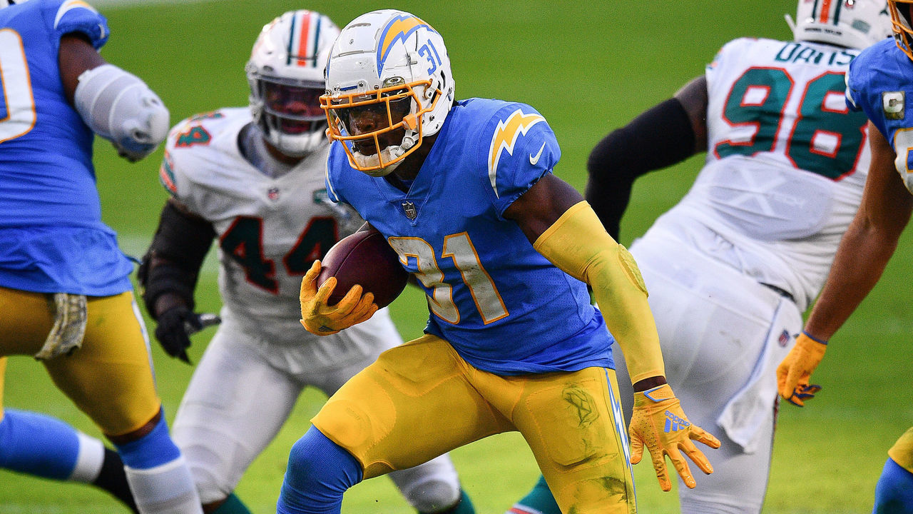 MIAMI GARDENS, FLORIDA - NOVEMBER 15: Kalen Ballage #31 of the Los Angeles Chargers runs the ball against the Miami Dolphins during the first half at Hard Rock Stadium on November 15, 2020 in Miami Gardens, Florida.