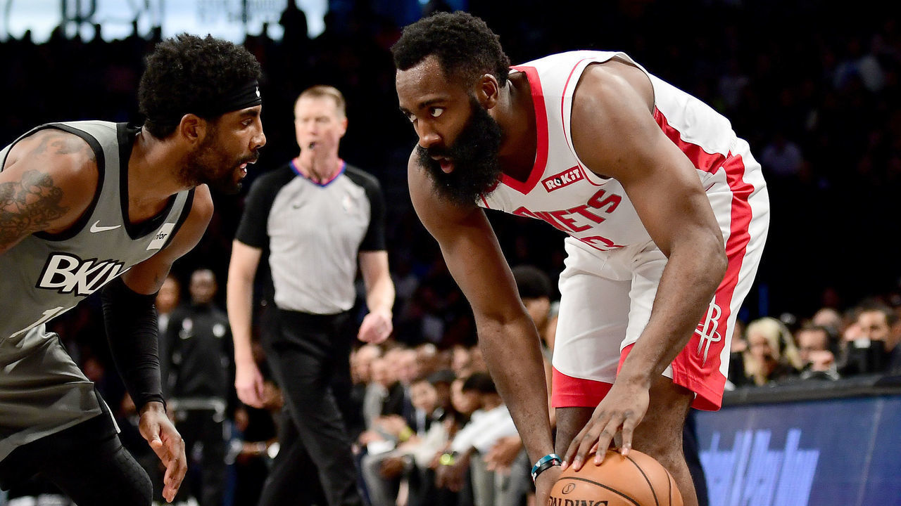 NEW YORK, NEW YORK - NOVEMBER 01: James Harden #13 of the Houston Rockets looks to drive past Kyrie Irving #11 of the Brooklyn Nets during the first half of their game at Barclays Center on November 01, 2019 in the Brooklyn borough New York City.
