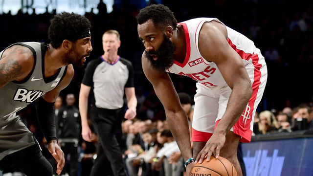 NEW YORK, NEW YORK - NOVEMBER 01: James Harden #13 of the Houston Rockets looks to drive past Kyrie Irving #11 of the Brooklyn Nets during the first half of their game at Barclays Center on November 01, 2019 in the Brooklyn borough New York City.