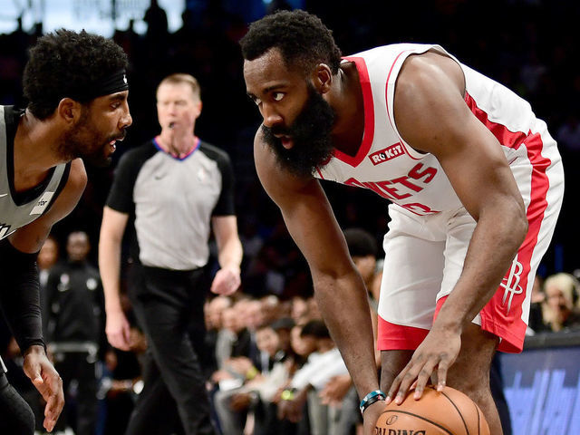 NEW YORK, NEW YORK - NOVEMBER 01: James Harden #13 of the Houston Rockets looks to drive past Kyrie Irving #11 of the Brooklyn Nets during the first half of their game at Barclays Center on November 01, 2019 in the Brooklyn borough New York City.