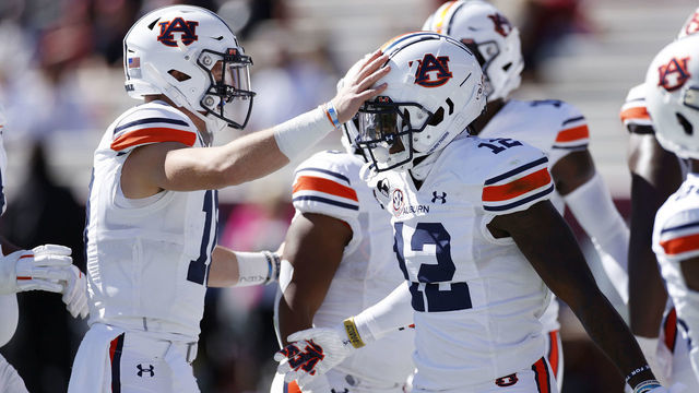 COLUMBIA, SC - OCTOBER 17: Bo Nix #10 and Eli Stove #12 of the Auburn Tigers celebrate after connecting on an 11-yard touchdown against the South Carolina Gamecocks in the first quarter of the game at Williams-Brice Stadium on October 17, 2020 in Columbia, South Carolina.