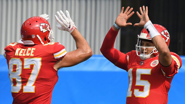 INGLEWOOD, CALIFORNIA - SEPTEMBER 20: Quarterback Patrick Mahomes #15 of the Kansas City Chiefs celebrates a touchdown by teammate tight end Travis Kelce #87 against the Los Angeles Chargers during the second quarter at SoFi Stadium on September 20, 2020 in Inglewood, California.
