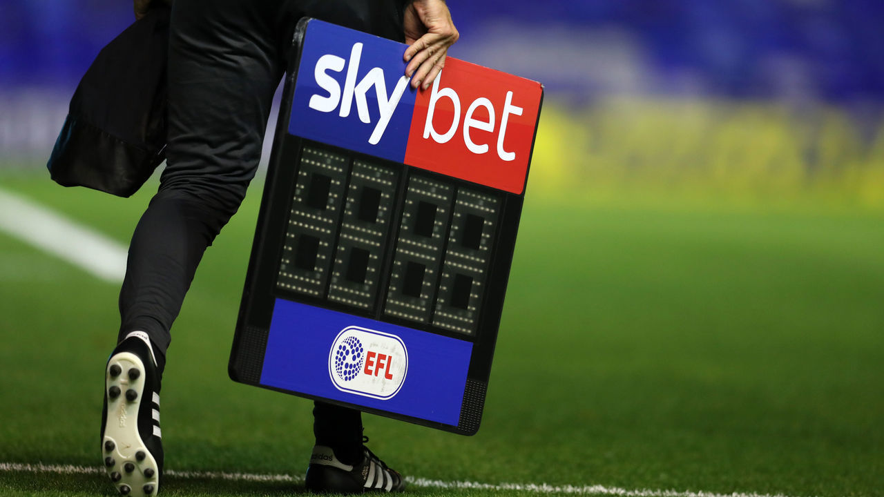 BIRMINGHAM, ENGLAND - SEPTEMBER 18: The fourth official carrys the Sky Bet EFL substitutes board across the pitch ahead of the Sky Bet Championship match between Coventry City and Queens Park Rangers at St Andrew's Trillion Trophy Stadium on September 18, 2020 in Birmingham, England.