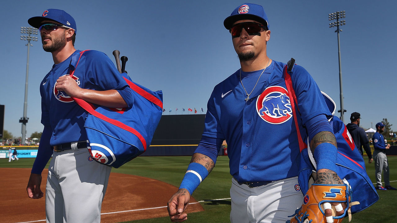 PEORIA, ARIZONA - FEBRUARY 24: Kris Bryant #17 and Javier Baez #9 of the Chicago Cubs arrives to the MLB spring training game against the Seattle Mariners at Peoria Stadium on February 24, 2020 in Peoria, Arizona.