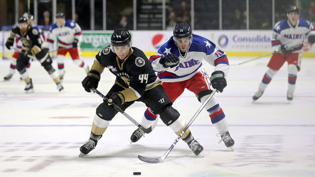 PORTLAND, ME - FEBRUARY 23: Maine Mariners' Greg Chase tries to steal possession from Newfoundland Growlers' Kyle Froese. (Staff photo by Ben McCanna/Portland Press Herald via Getty Images)
