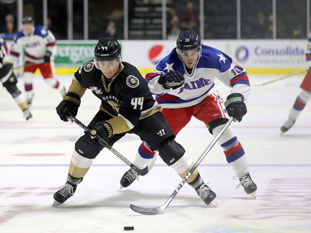 PORTLAND, ME - FEBRUARY 23: Maine Mariners' Greg Chase tries to steal possession from Newfoundland Growlers' Kyle Froese. (Staff photo by Ben McCanna/Portland Press Herald via Getty Images)