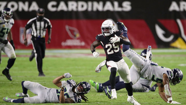 GLENDALE, ARIZONA - OCTOBER 25: Running back Chase Edmonds #29 of the Arizona Cardinals rushes the football against the Seattle Seahawks during the NFL game at State Farm Stadium on October 25, 2020 in Glendale, Arizona. The Cardinals defeated the Seahawks 37-34 in overtime.