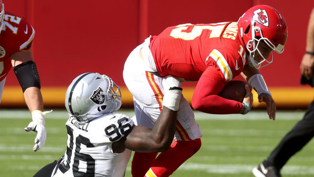 KANSAS CITY, MISSOURI - OCTOBER 11: Clelin Ferrell #96 of the Las Vegas Raiders wraps up Patrick Mahomes #15 of the Kansas City Chiefs during the fourth quarter at Arrowhead Stadium on October 11, 2020 in Kansas City, Missouri.