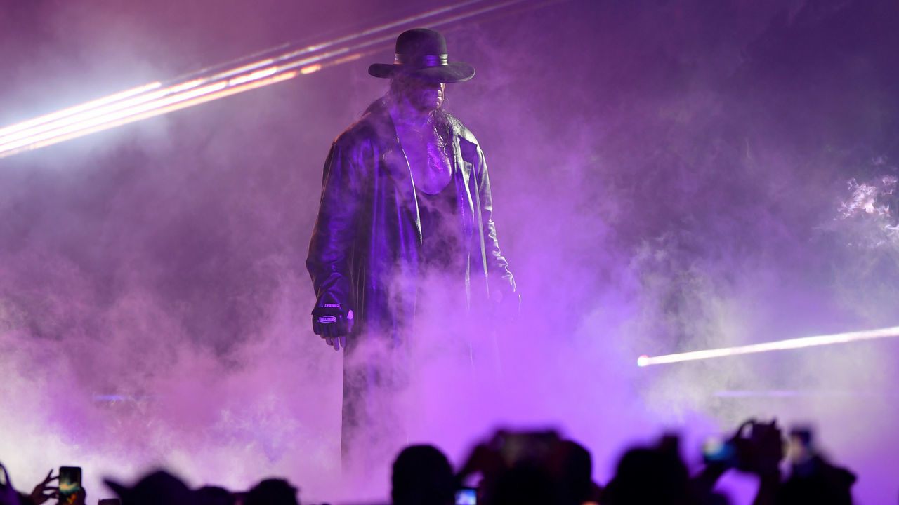 TOPSHOT - World Wrestling Entertainment star The Undertaker makes his way to the ring during a match at the World Wrestling Entertainment (WWE) Super Showdown event in the Saudi Red Sea port city of Jeddah late on January 7, 2019.