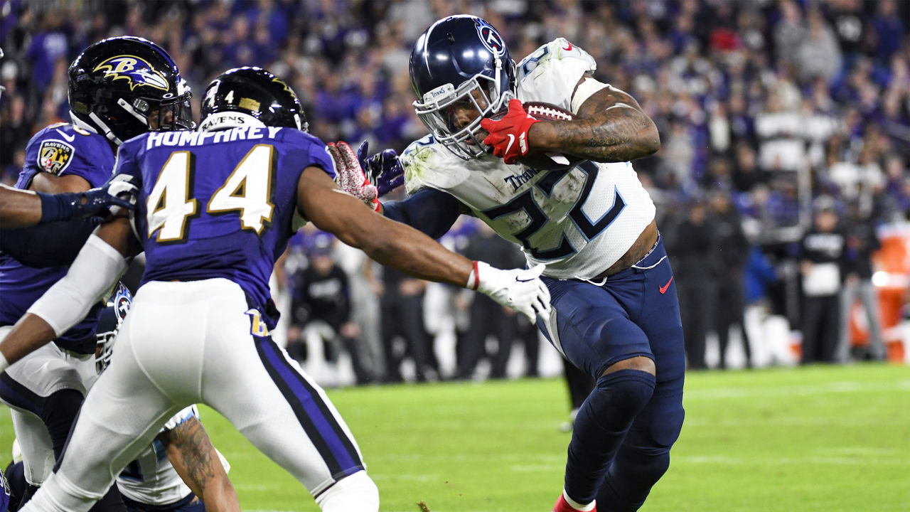 BALTIMORE, MD - JANUARY 11: Tennessee Titans running back Derrick Henry (22) avoids a tackle attempt by Baltimore Ravens cornerback Marlon Humphrey (44) on January 11, 2020, at M&T Bank Stadium in Baltimore, MD.
