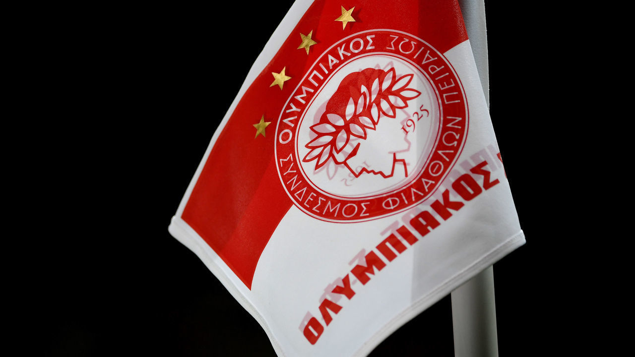 PIRAEUS, GREECE - MARCH 12: A detailed view of the logo on a corner flag of Olympiacos FC during the UEFA Europa League round of 16 first leg match between Olympiacos FC and Wolverhampton Wanderers at Karaiskakis Stadium on March 12, 2020 in Piraeus, Greece. The match is played behind closed doors as a precaution against the spread of COVID-19 (Coronavirus).