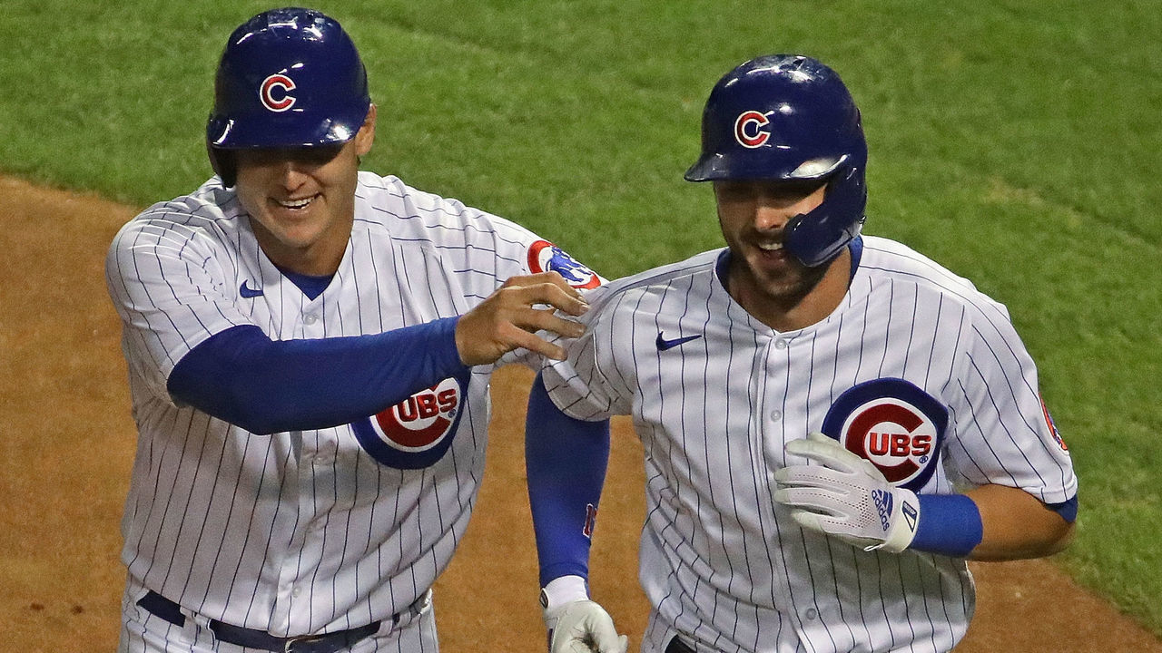 CHICAGO, ILLINOIS - SEPTEMBER 04: Anthony Rizzo #44 of the Chicago Cubs (L) grabs Kris Bryant #17 after both scored in the 1st inning against the St. Louis Cardinals at Wrigley Field on September 04, 2020 in Chicago, Illinois.