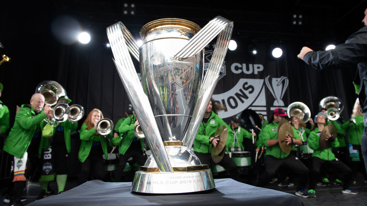 SEATTLE, WASHINGTON - NOVEMBER 12: The MLS Cup trophy sits on stage while the Seattle Sounders pep band Soundwave perform during the Seattle Sounders MLS Cup victory parade and rally on November 12, 2019 in Seattle, Washington.