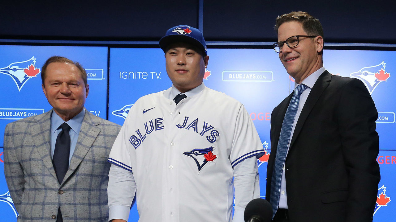 TORONTO, ON- DECEMBER 27 - Scott Boras, Ryus agent, General Manager Russ Atkins, and Blue Jays president and CEO Mark Shapiro pose as The Toronto Blue Jays host a media availability with new signed free agent left handed pitcher Hyun-Jin Ryu at Rogers Centre in Toronto. December 27, 2019. (Steve Russell/Toronto Star via Getty Images)